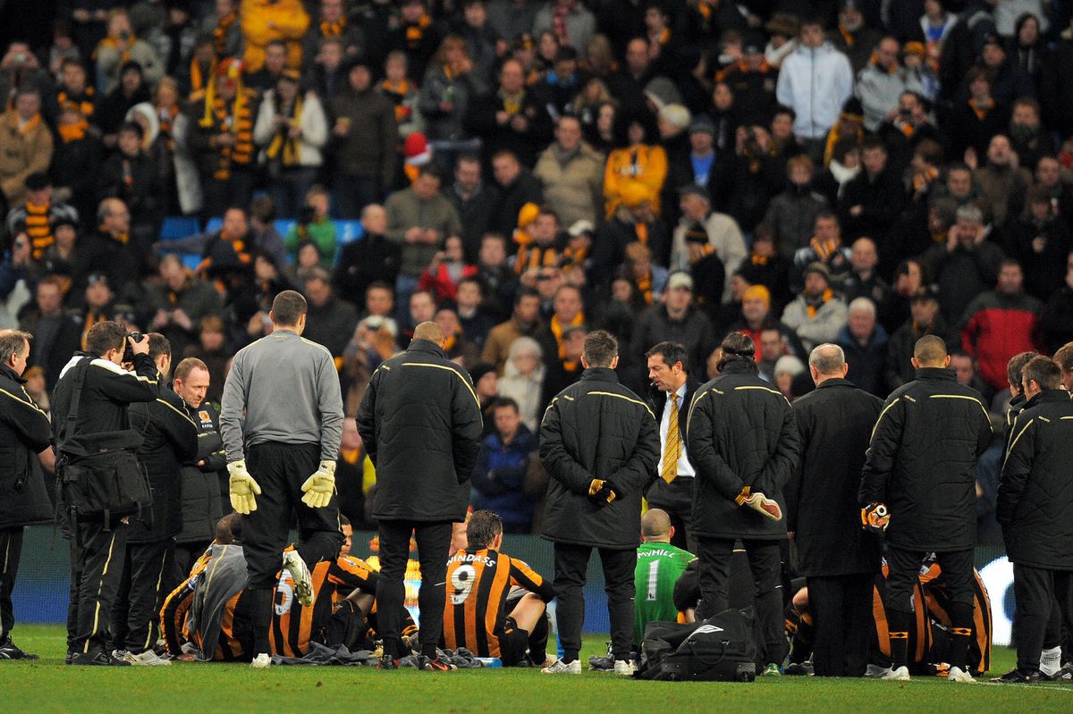 Phil Brown delivers his half-time team talk on the Manchester City pitch on Boxing Day 2008