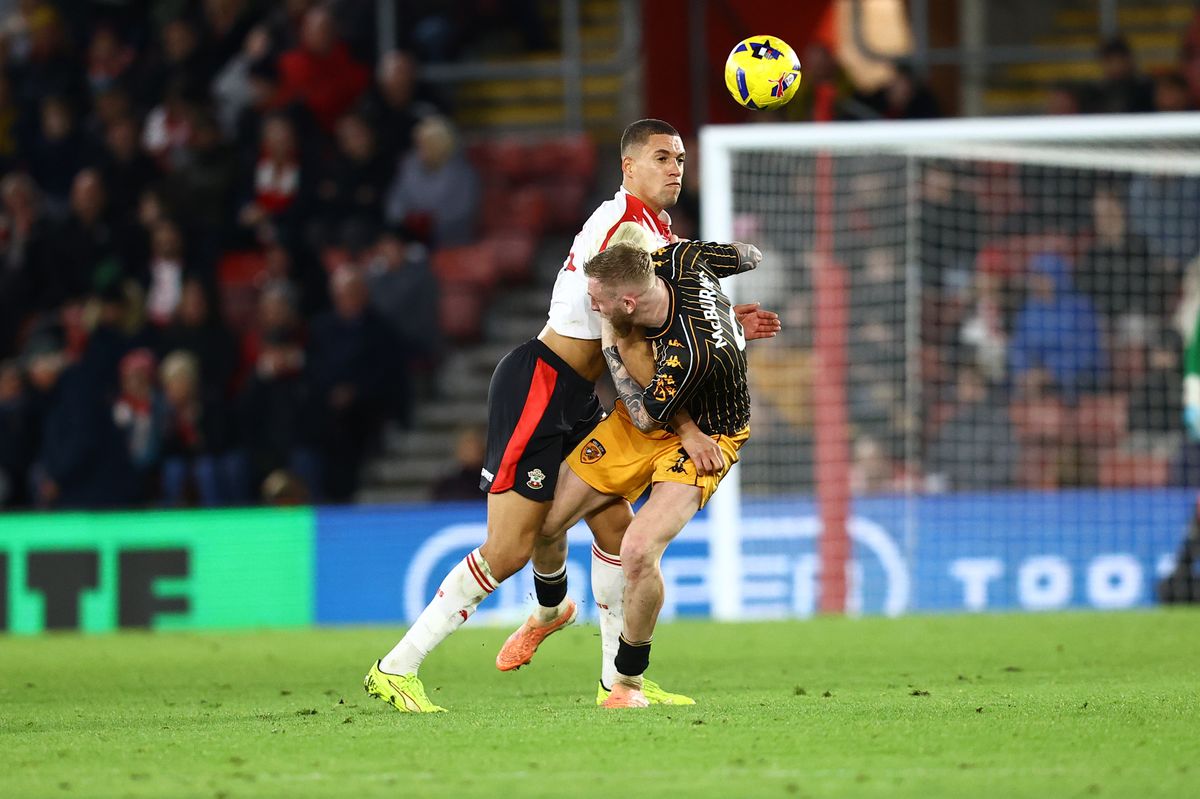 Southampton's Nathan Wood and Oli McBurnie battle at St Mary's