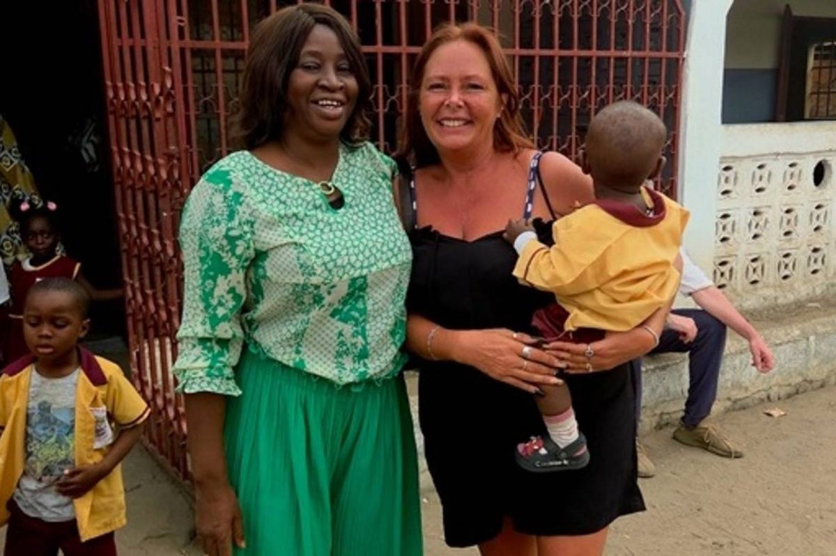 Tracey Dennison with some of the school children and their teacher at Living World of Faith World Changers in The Gambia