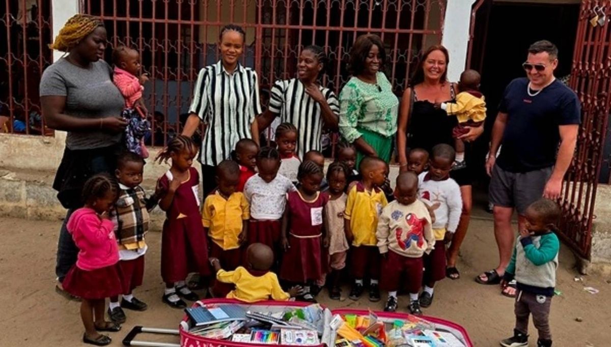Tracey Dennison with some of the staff and children from Living World of Faith World Changers in The Gambia