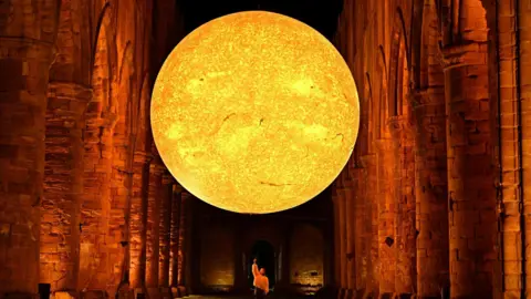 Anthony Chappell-Ross, courtesy of National Trust Images Art installation Helois - featuring detailed imagery of the sun's surface - pictured inside Fountains Abbey near Ripon. 