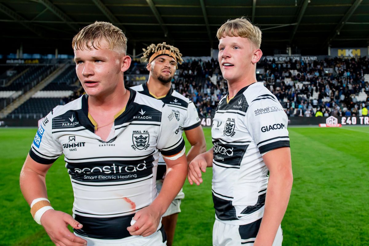 Hull FC brothers Callum & Lloyd Kemp at the end of the game after victory over Warrington.