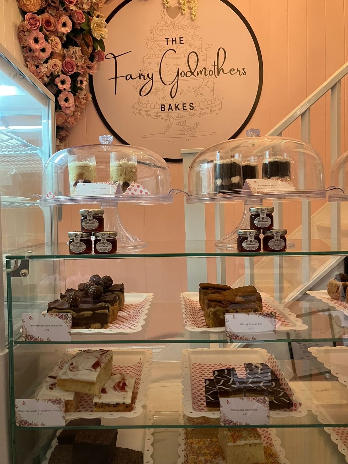 The counter full of beautiful cakes and sweet baked good