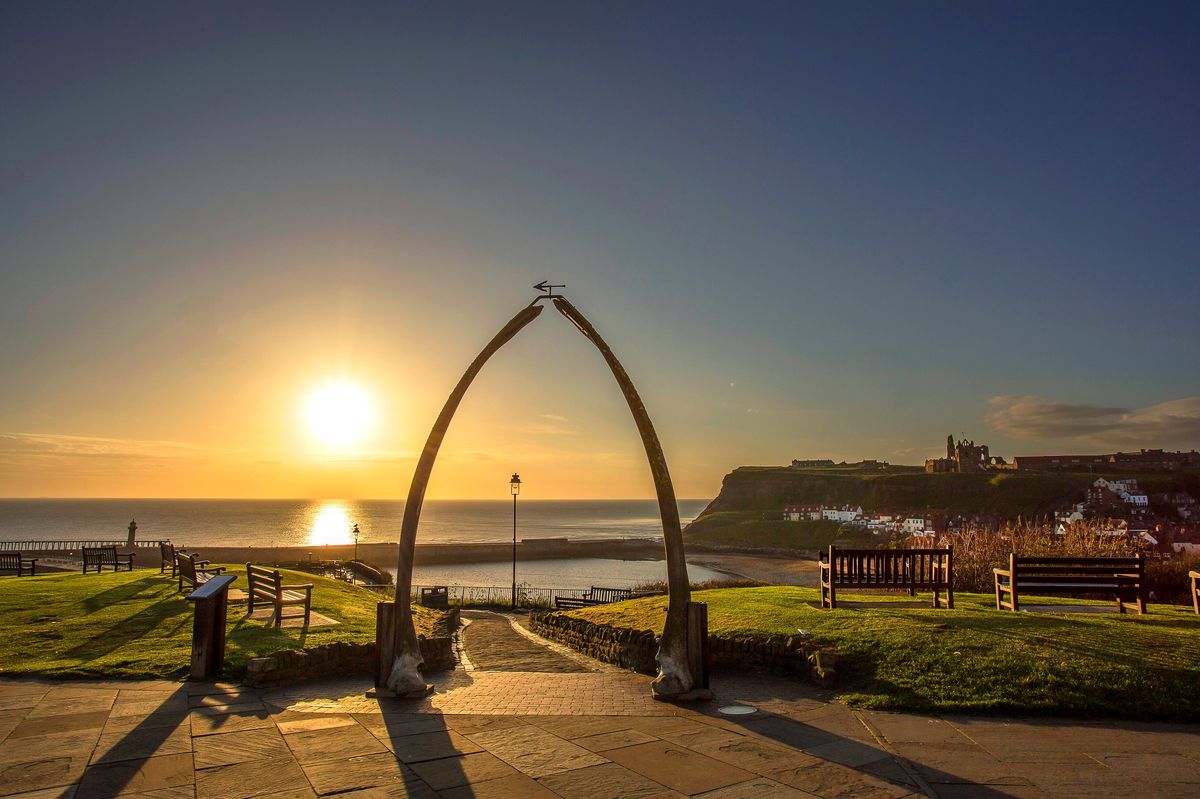 A beautiful sunrise over the North Yorkshire town of Whitby through the famous whale bones
