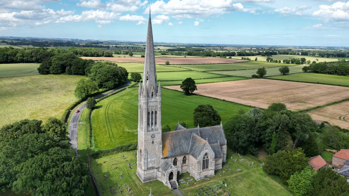 A drone shot of the St Marys Church in South Dalton - highest in East Yorkshire, England