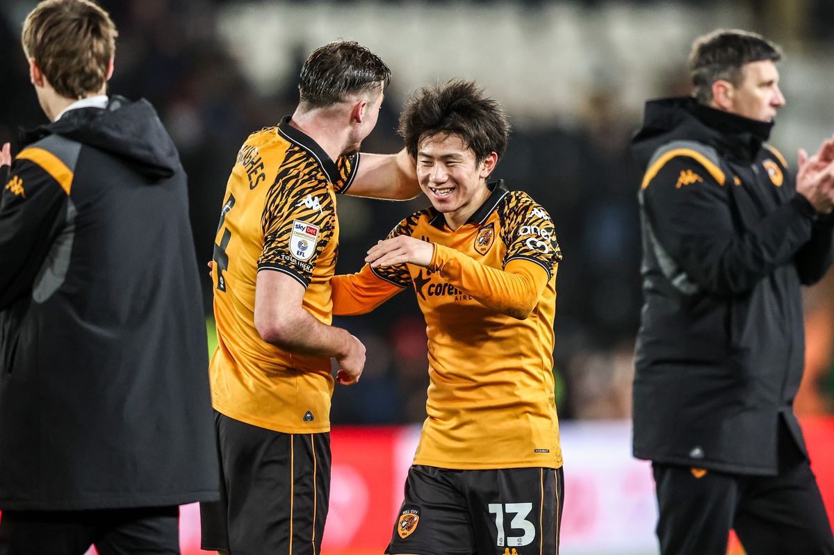 Charlie Hughes and Yu Hirakawa celebrate the win over Swansea City