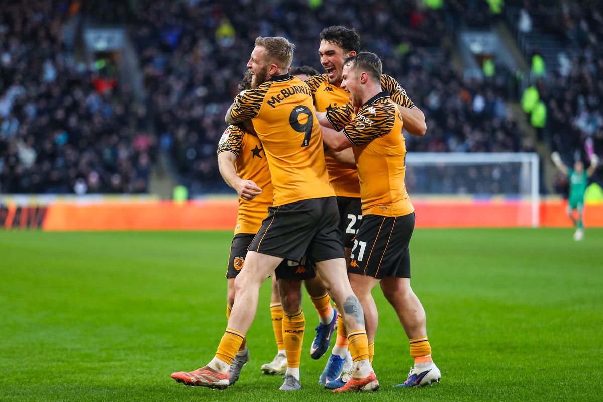 Regan Slater celebrates with his teammates after scoring against Swansea City