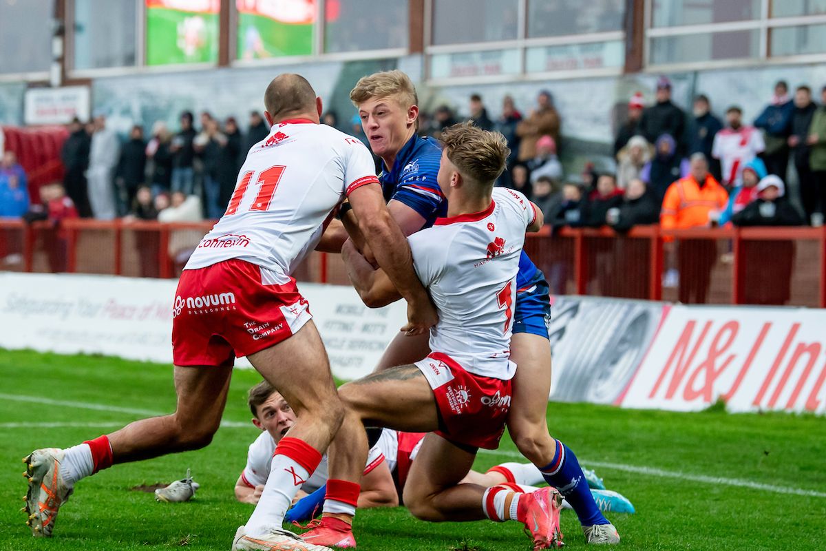 Wakefield's Jayden Myers is tackled by Hull KR's Karl Lawton