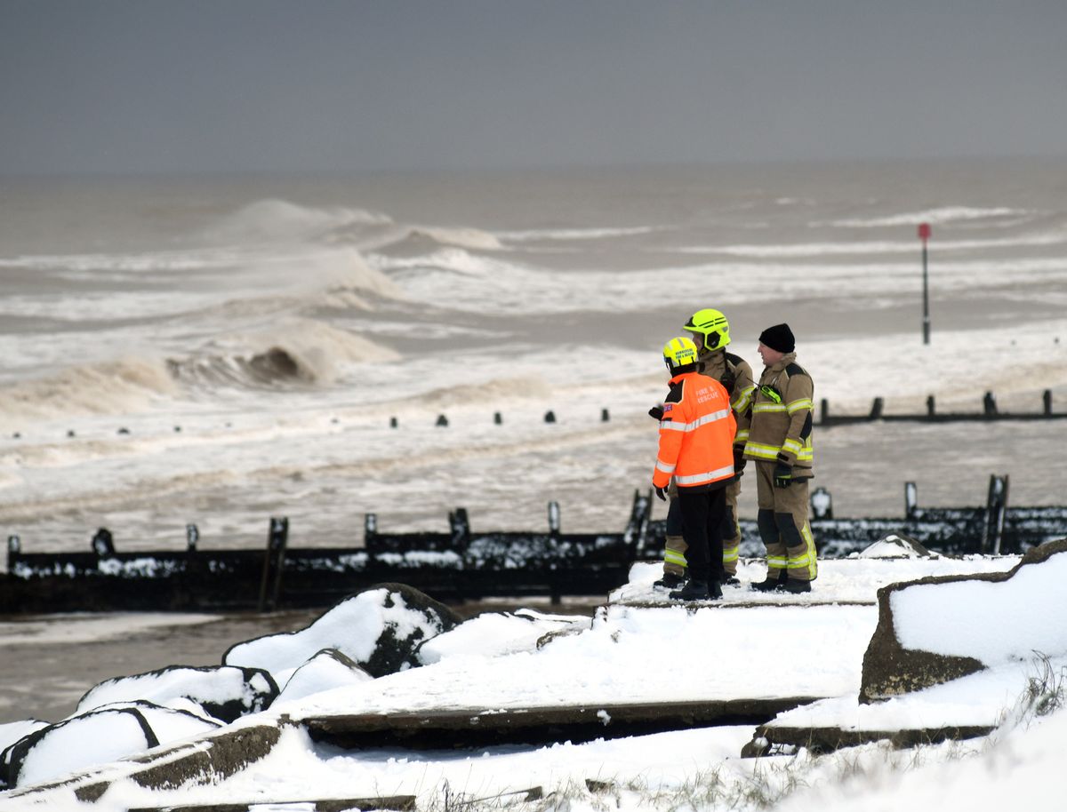 Emergency services personnel conducting a search of Withernsea seafront