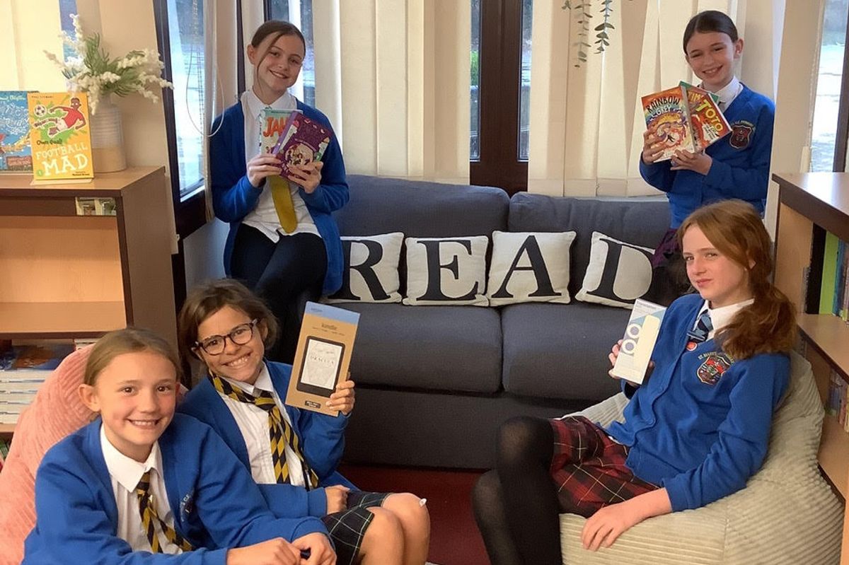The fundraising school children in their new reading corner at St Mary's in Beverley
