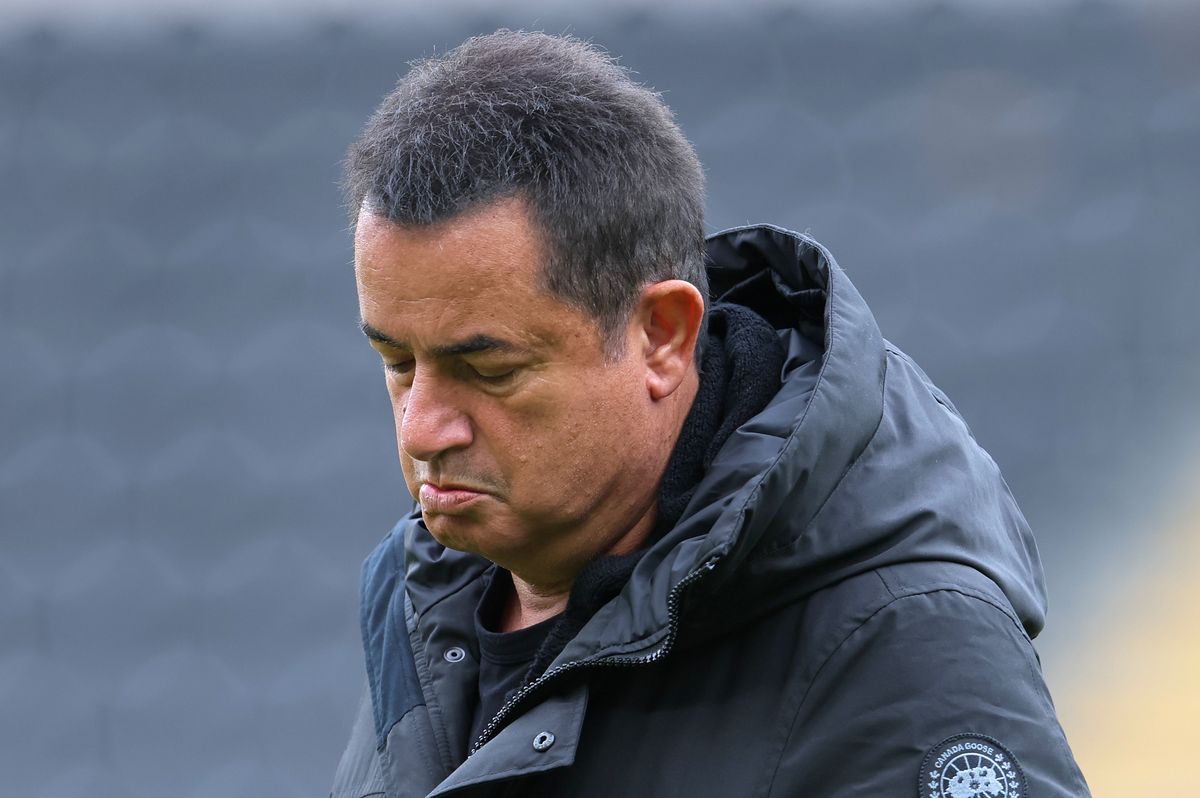 Acun Ilicali takes a look at the MKM Stadium pitch before the QPR game