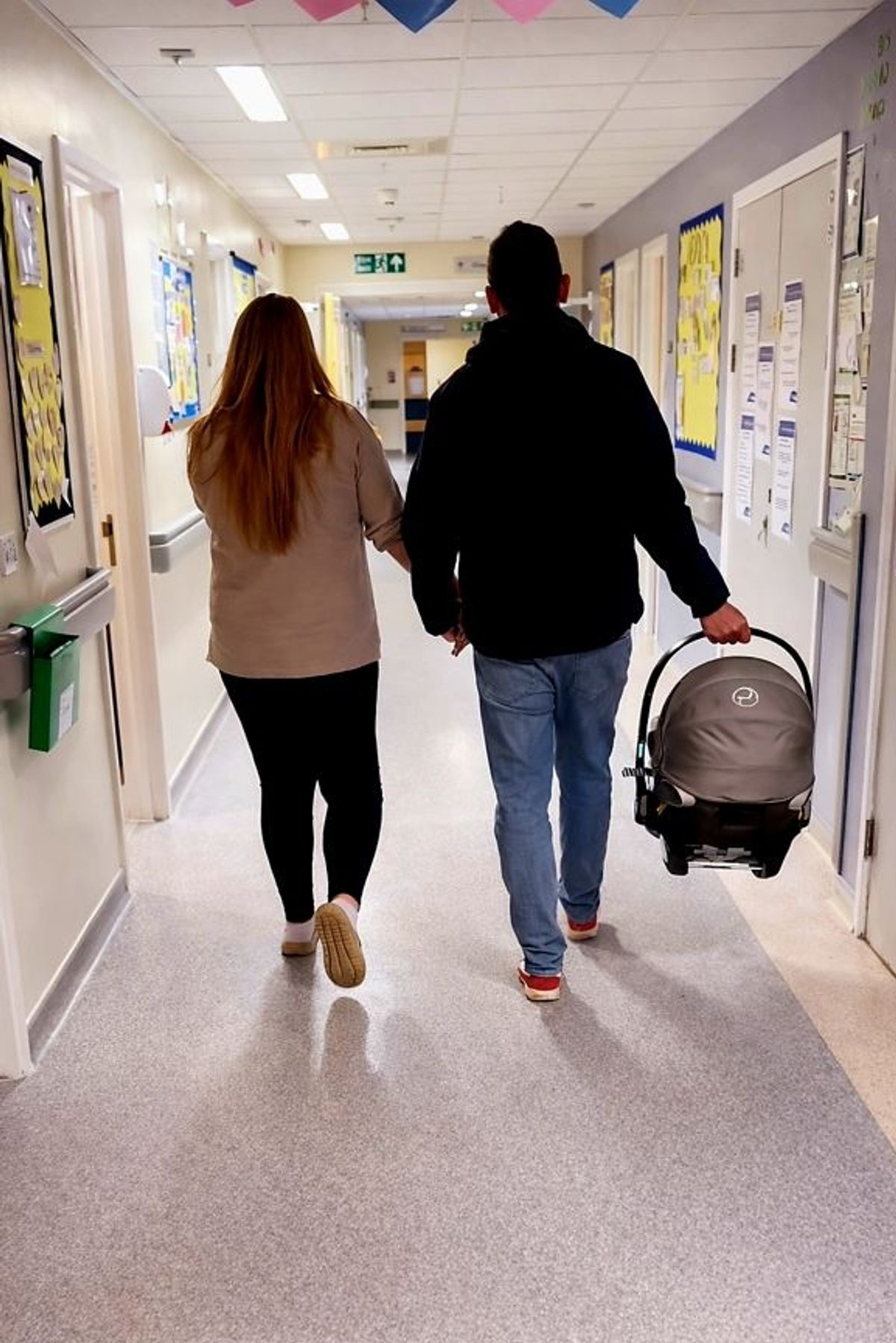 Clare Brooks and Paul Webb leaving hospital last month with their newborn baby Fallon
