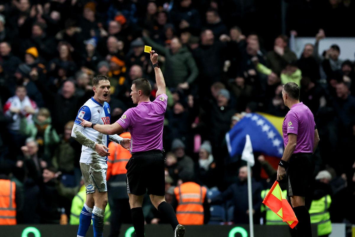 Blackburn Rovers' Sean McLoughlin is booked after Hull City's winner