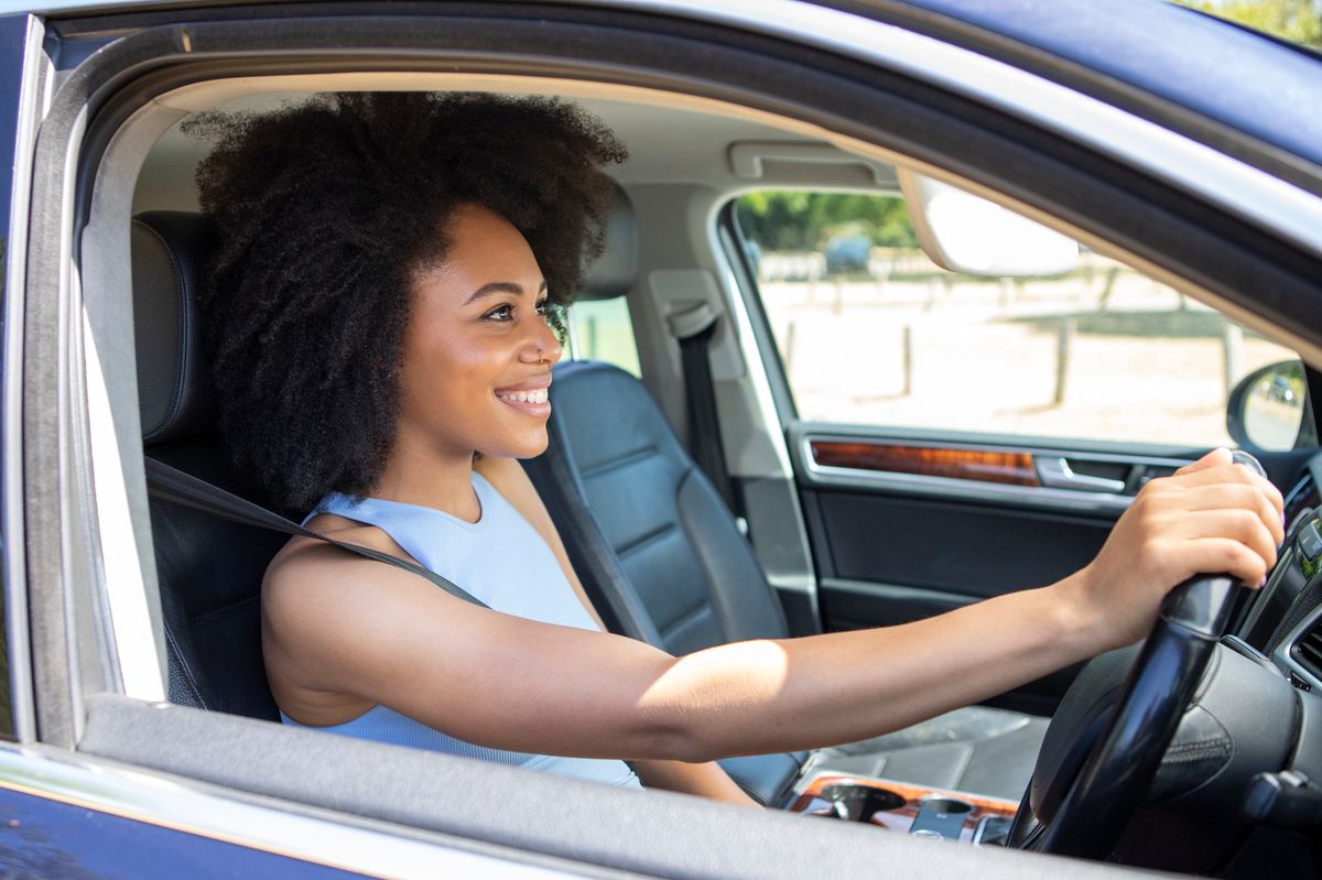 Young woman driving car