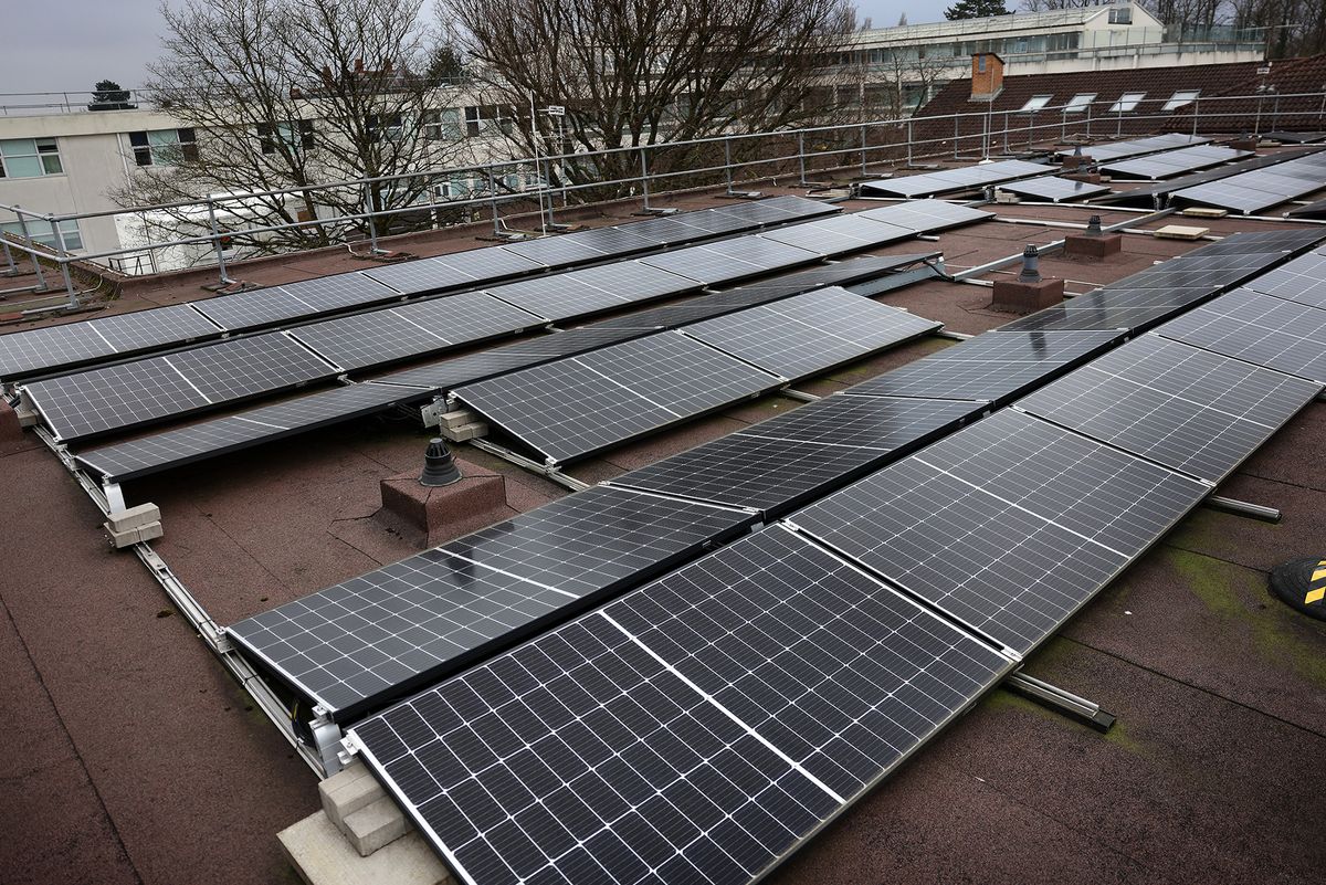 Solar panels on a roof - community projects invest in renewable energy projects to then be owned by local people