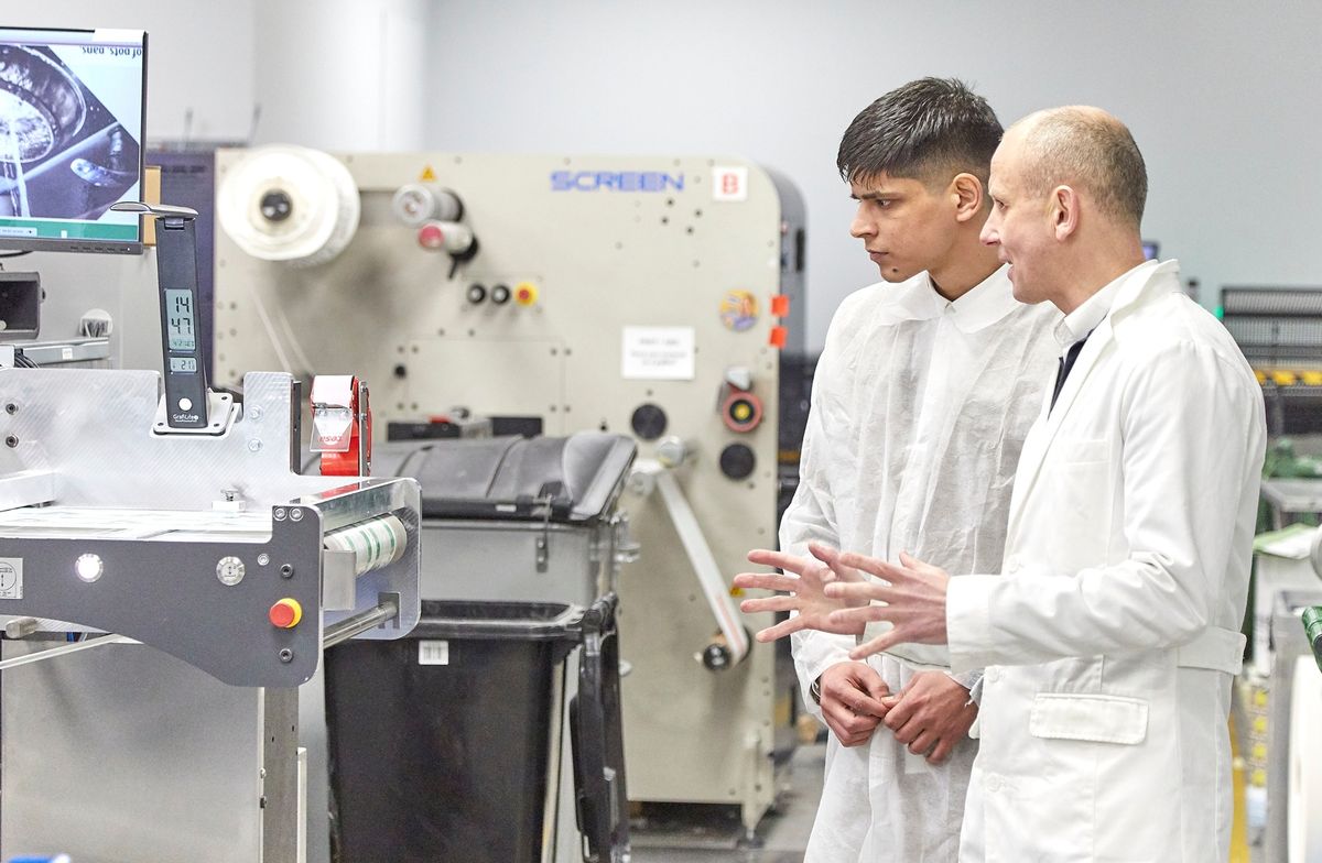 Springfield Solutions managing director Matt Dass, right, shows University of Hull graduate Hemant Joshi around the company’s printing operations in Hull.