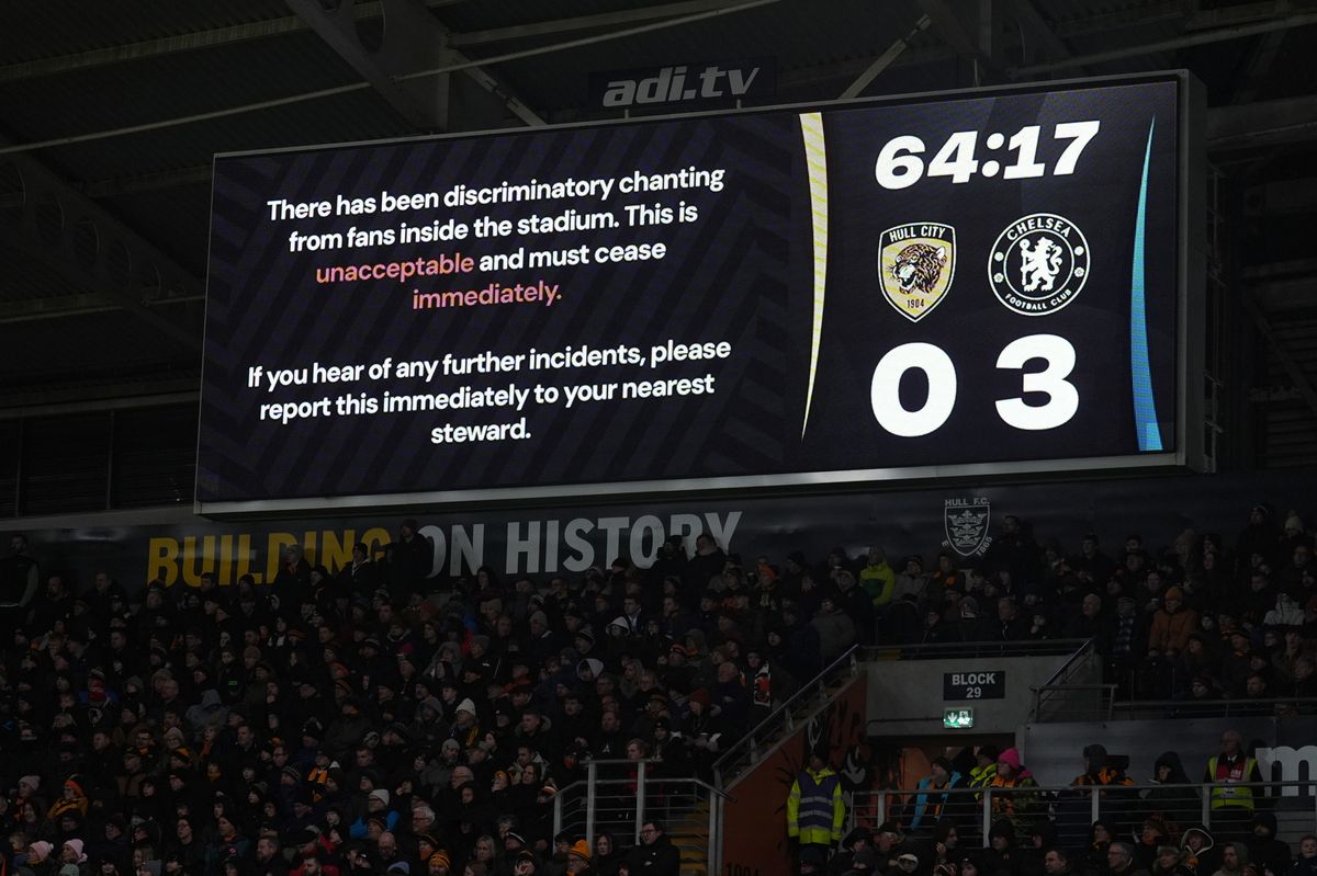 The MKM Stadium screens display a message about chanting during the game