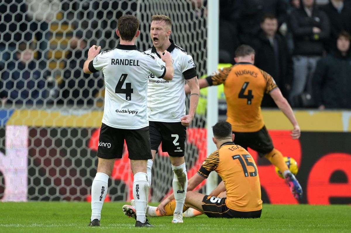Ross McCrorie celebrates with Adam Randell at the MKM Stadium as John Egan and Charlie Hughes show their frustration
