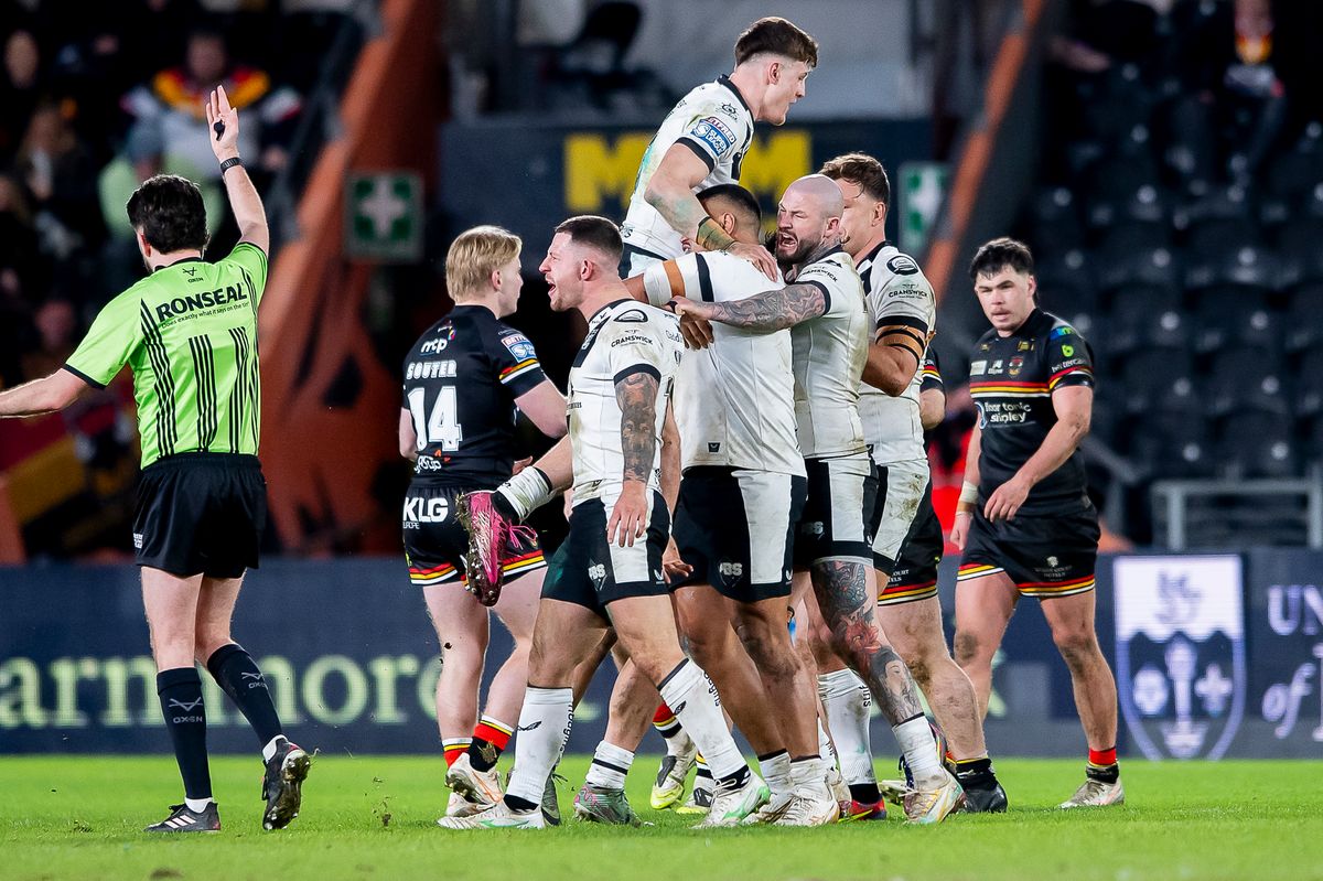 Hull FC players celebrate a defensive win.