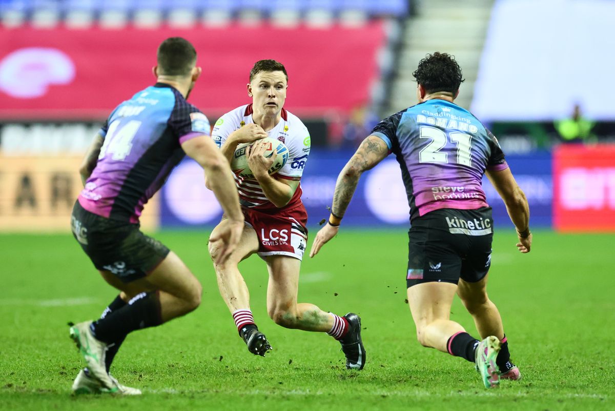 Wigan Warriors' Jai Field on the attack against Hull FC.