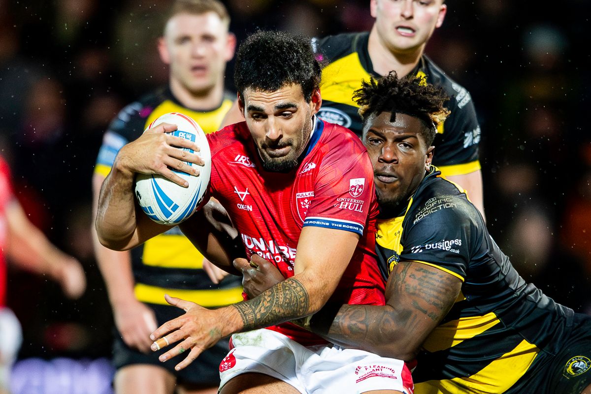 Hull KR's Tyrone May is tackled by York's Justin Sangare.