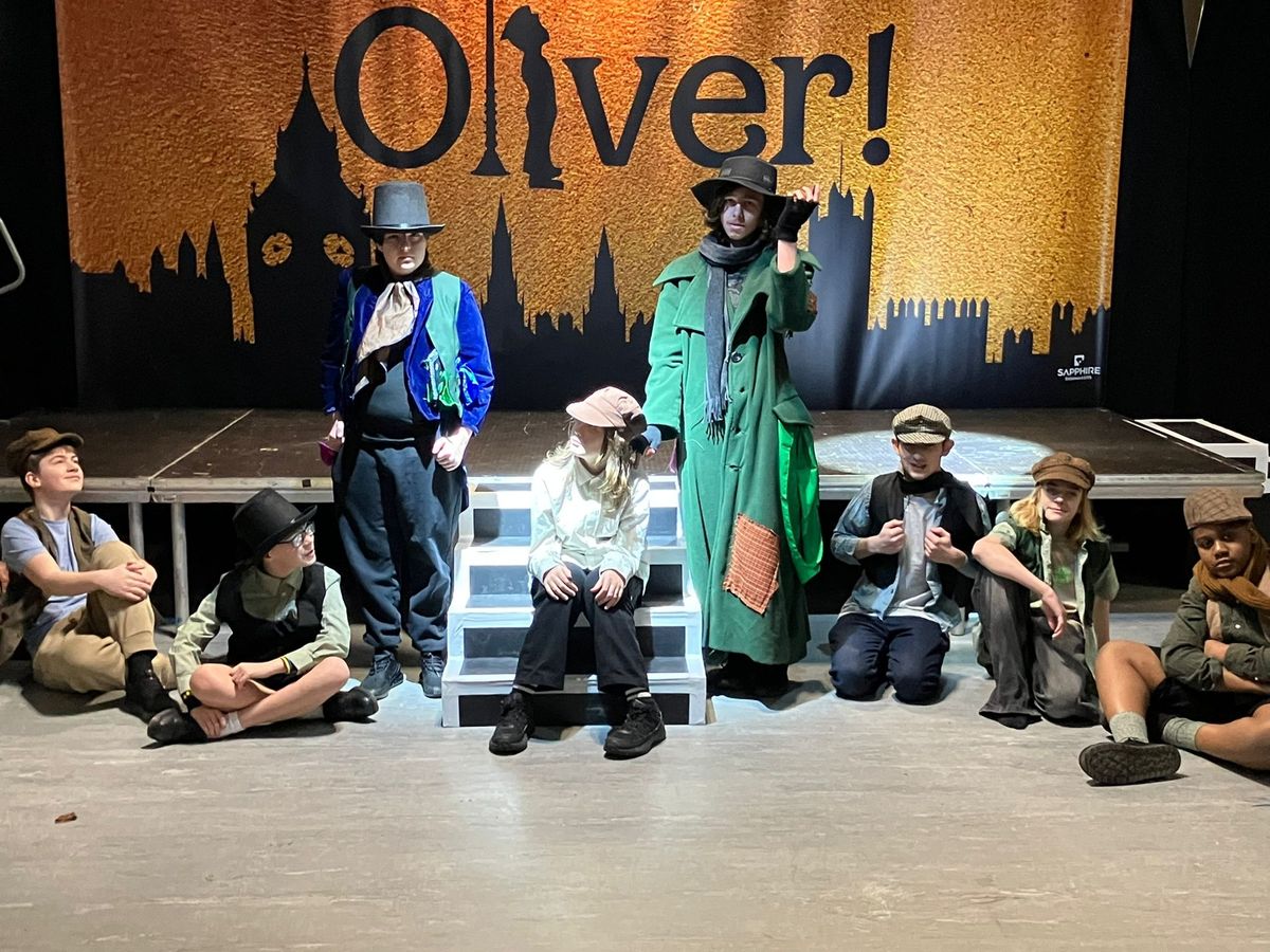 Fagin, Dodger, and some of the ensemble cast