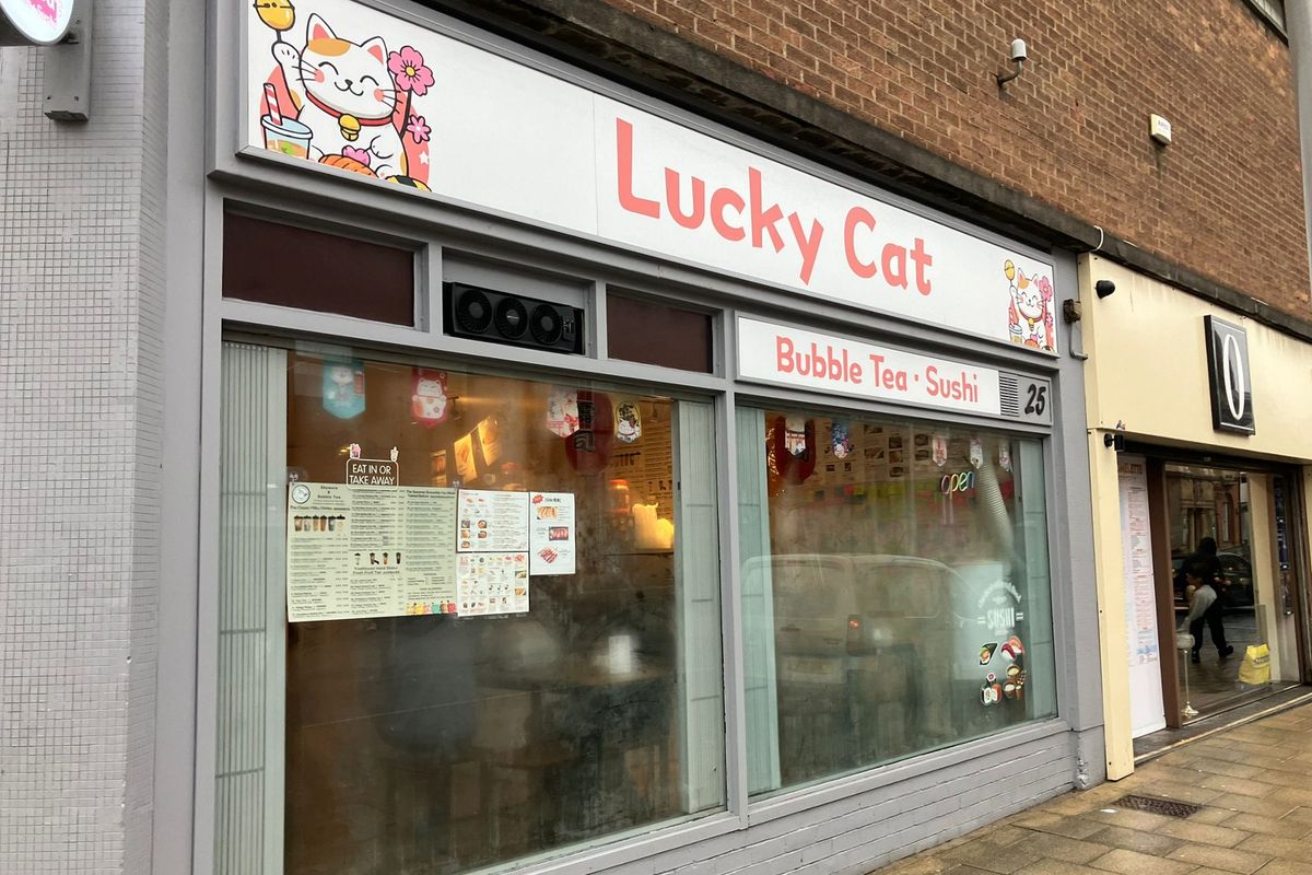 Lucky Cat in Story Street, Hull, with its cute cartoon mascot