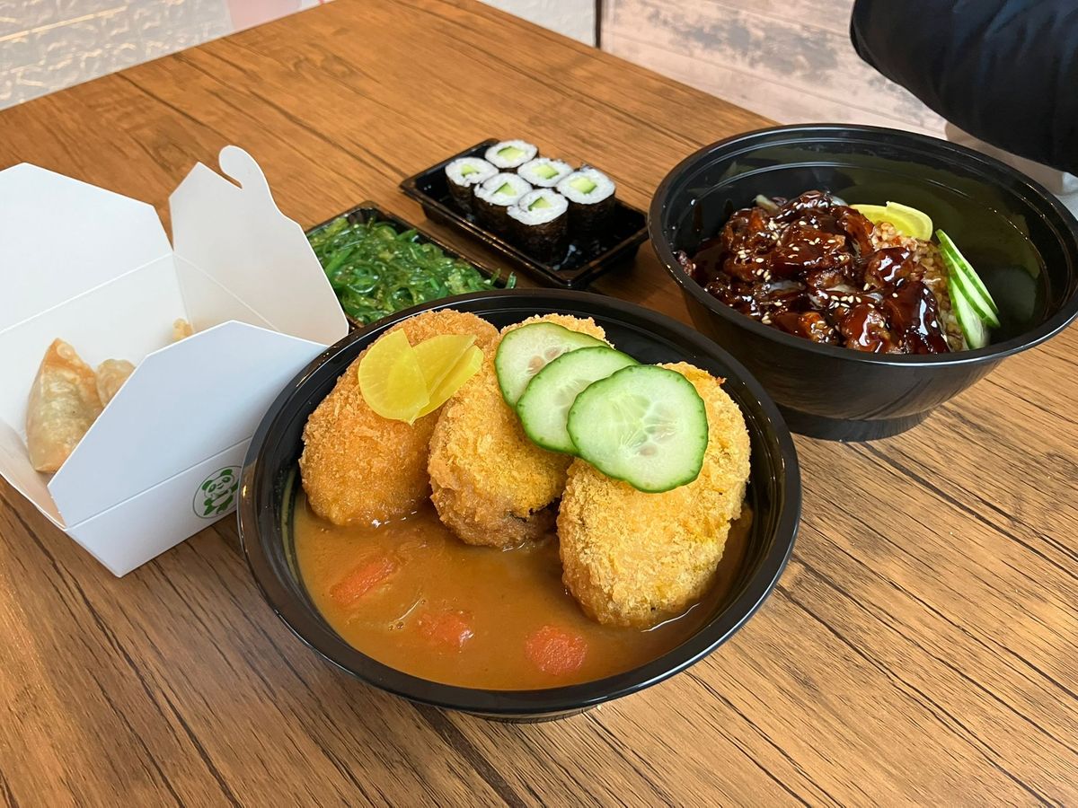 Pictured is pumpkin katsu, vegetable gyoza, wakame seaweed salad, maki rolls, and beef gyu don