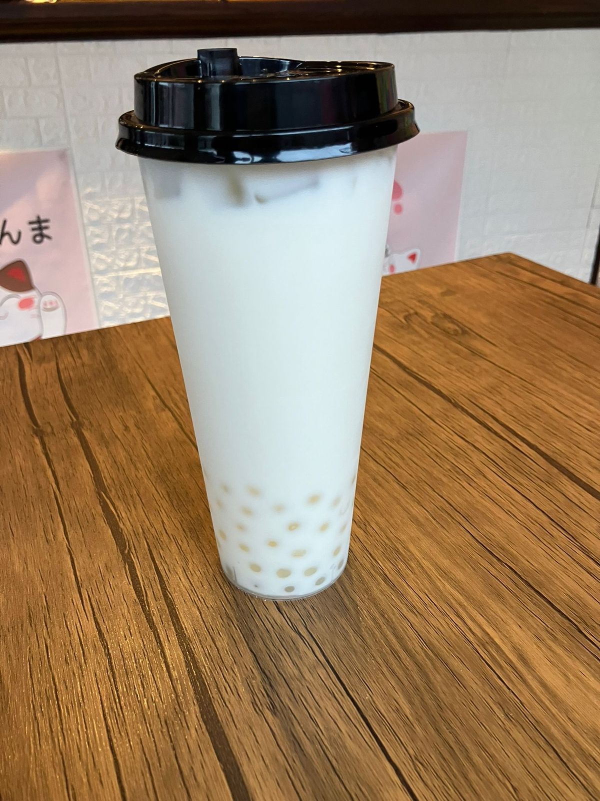 The bubble tea is served in an exceptionally tall cup and you get a lot of it