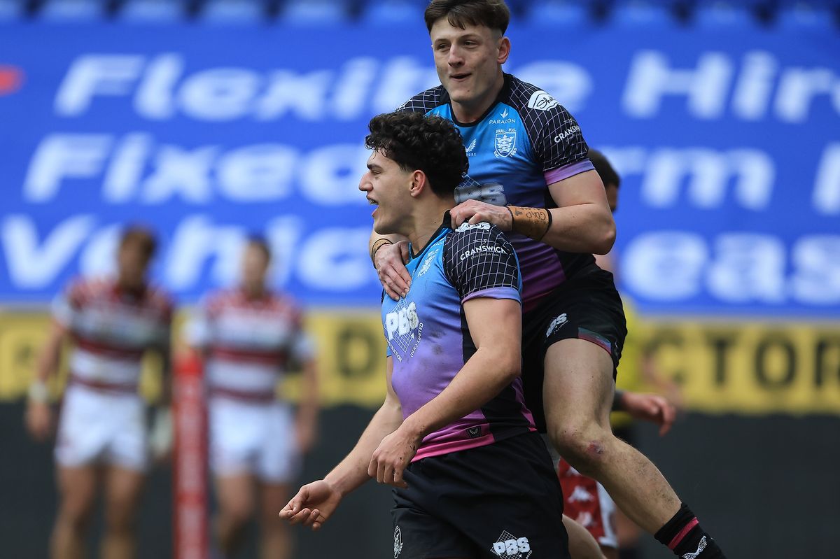 Hull FC winger Lewis Martin celebrates a try with Davy Litten. 