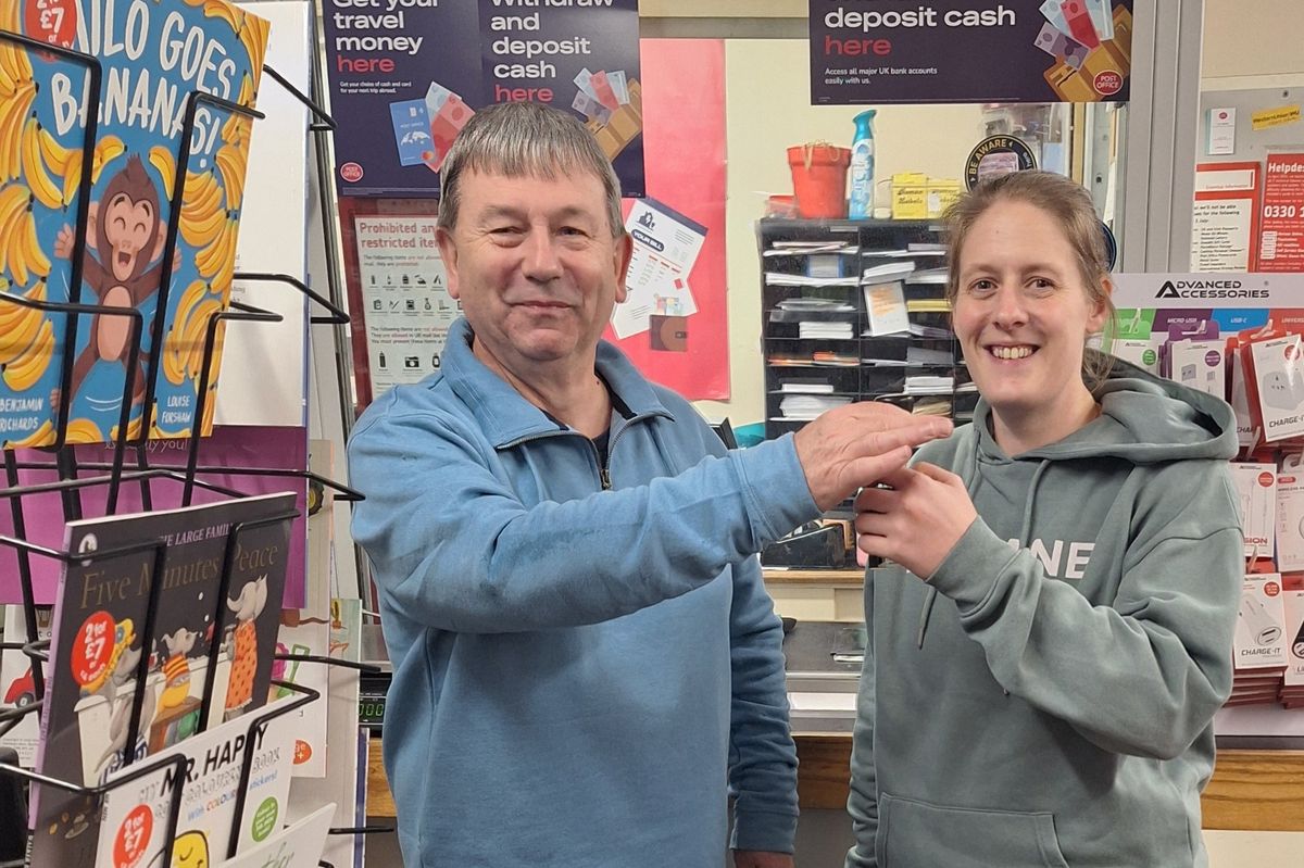 John Shepherd passes the keys to the new postmaster Rachel Chandrakumar