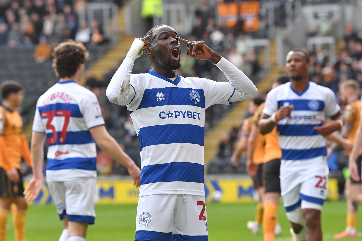 Queens Park Rangers defender Amadou Mbengue celebrates at Hull City