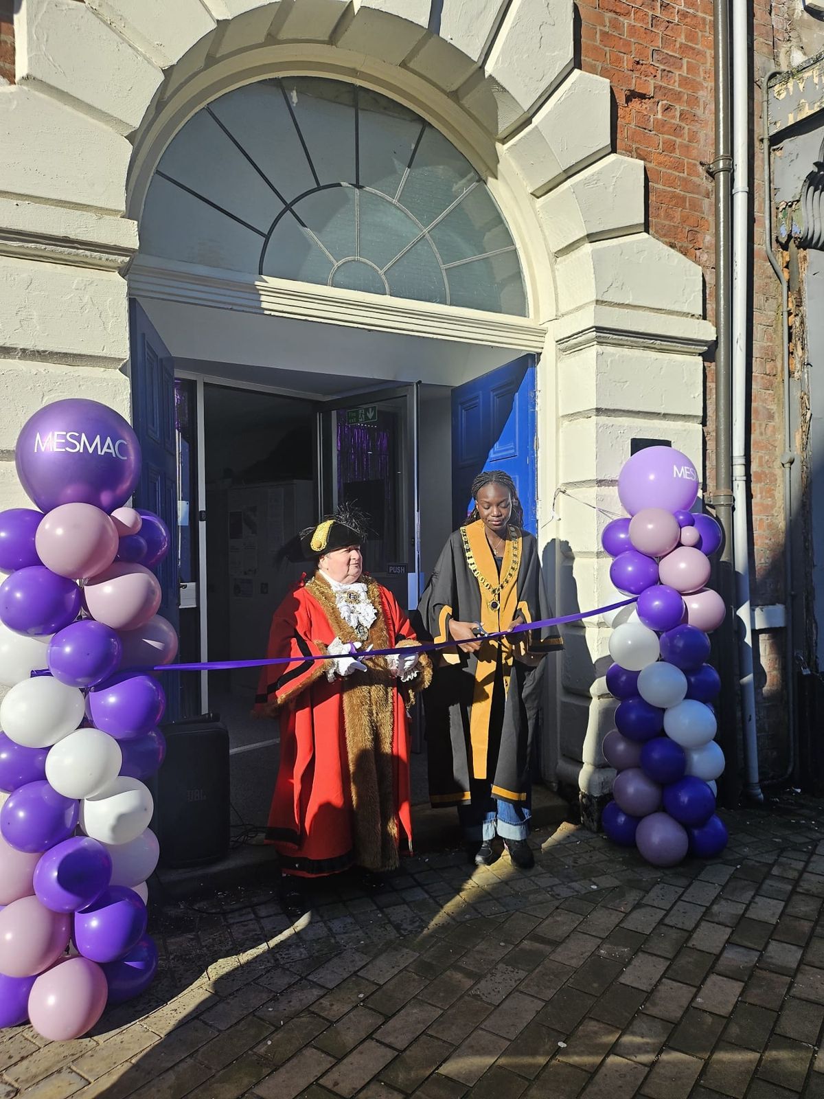 Lord Mayor Cheryl Payne and Young Lord Mayor Eunice cut the ribbon at MESMAC, 8 King Street, Trinity Square, Hull