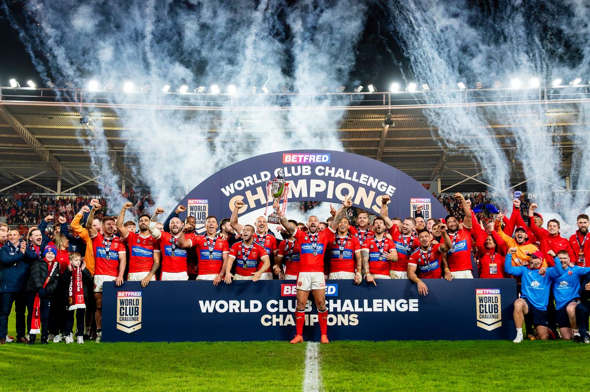 Hull KR's Elliot MInchella lifts the Betfred World Club Challenge Trophy after victory over Brisbane Broncos.