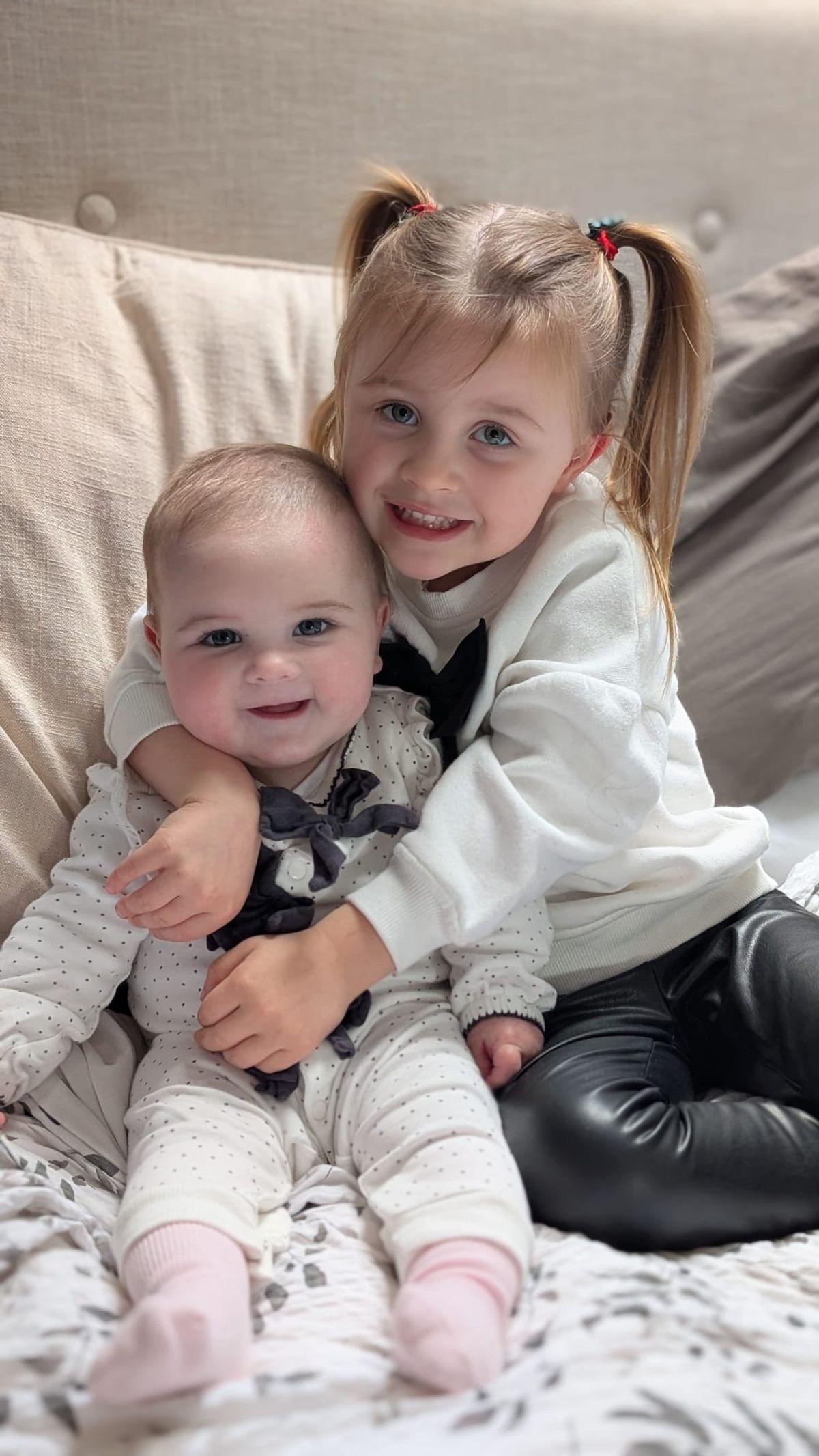 Darcy Henderson-Kidd with her baby sister Polly