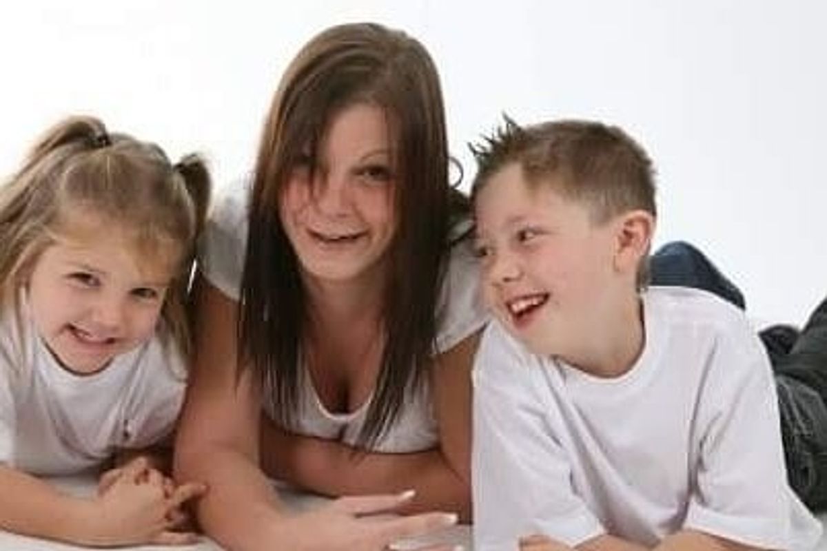 Riley Cameron with his sister, Rihanna and mum, Rachel