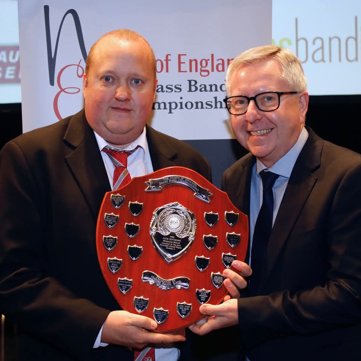 James Kerridge (L), best solo cornet shield presented by David Roberts (R)