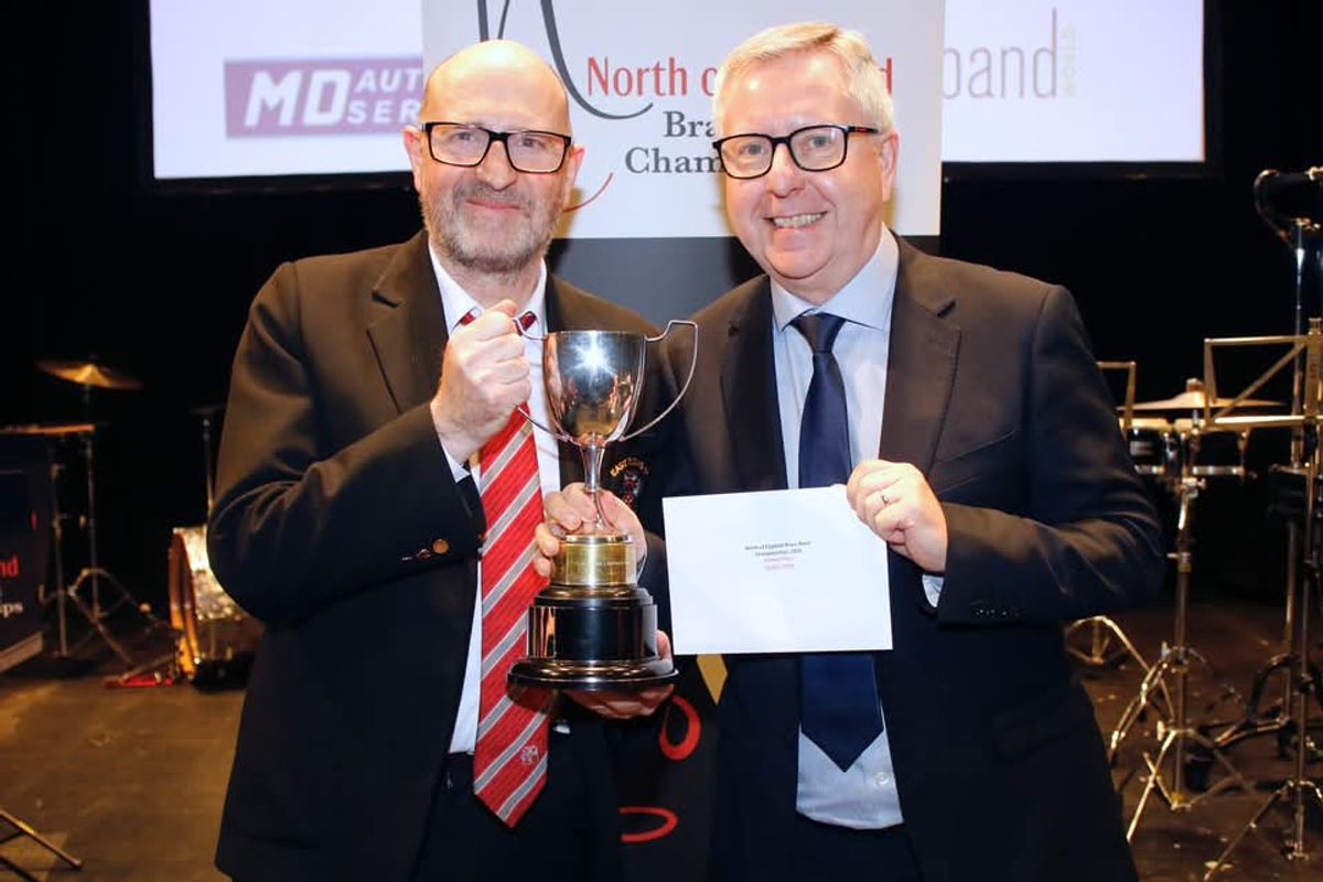 David Vivian (L) holds second place trophy presented by David Roberts