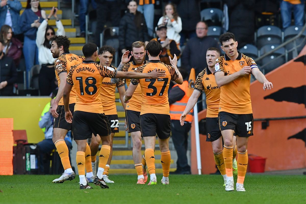 Hull City players celebrate an own goal by Sheffield Wednesday 