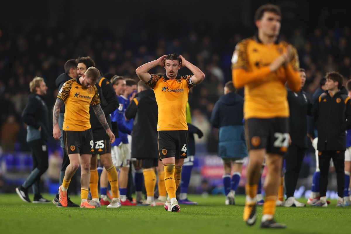 Charlie Hughes and his Hull City teammates react after the defeat at Ipswich Town