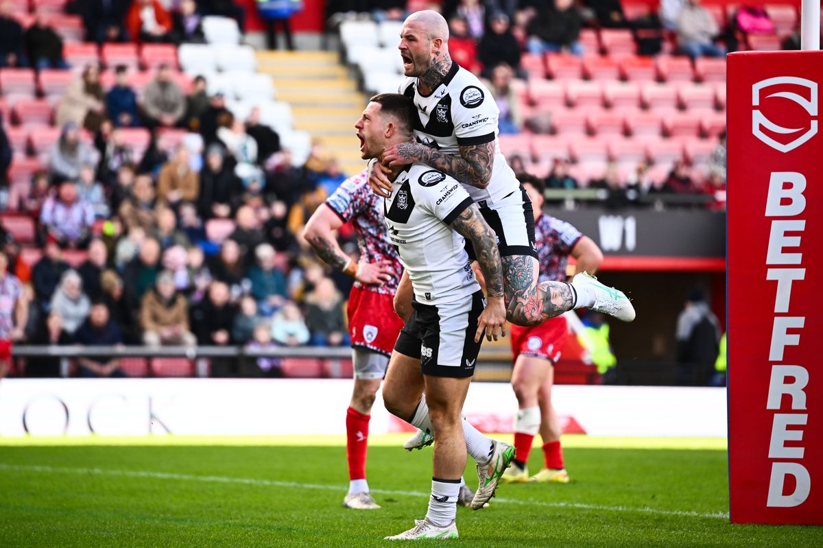 Hull FC's Cade Cust celebrates his try with Zak Hardaker.