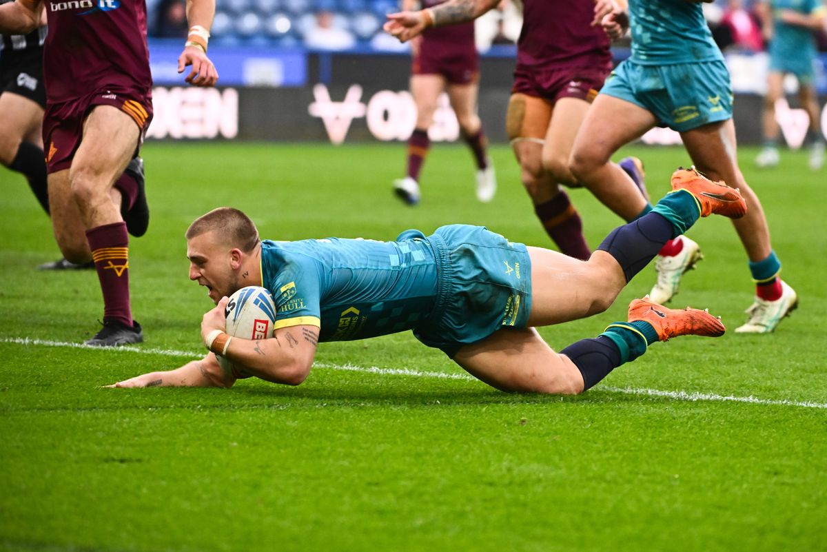 Hull KR star Mikey Lewis scores against Huddersfield Giants.