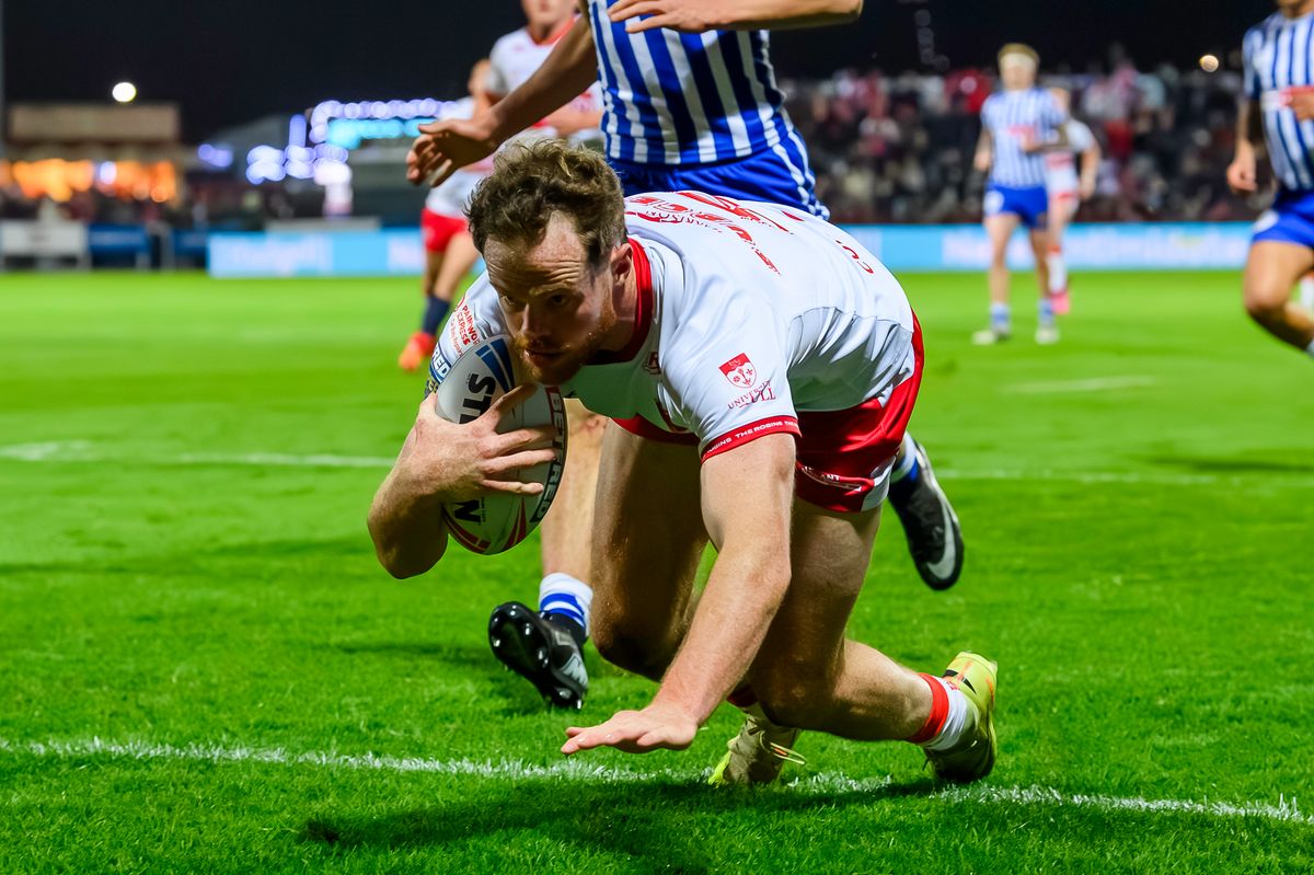 Hull KR's Joe Burgess scores a try against St Helens.