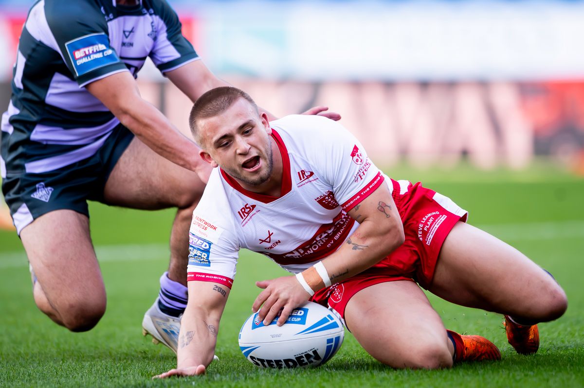  Hull KR's Mikey Lewis breaks free to score a try against Huddersfield Giants in the Challenge Cup.