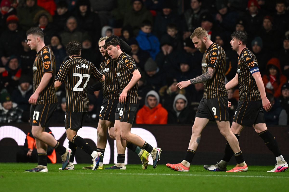 Lewis Koumas celebrates with his Hull City teammates at Wrexham