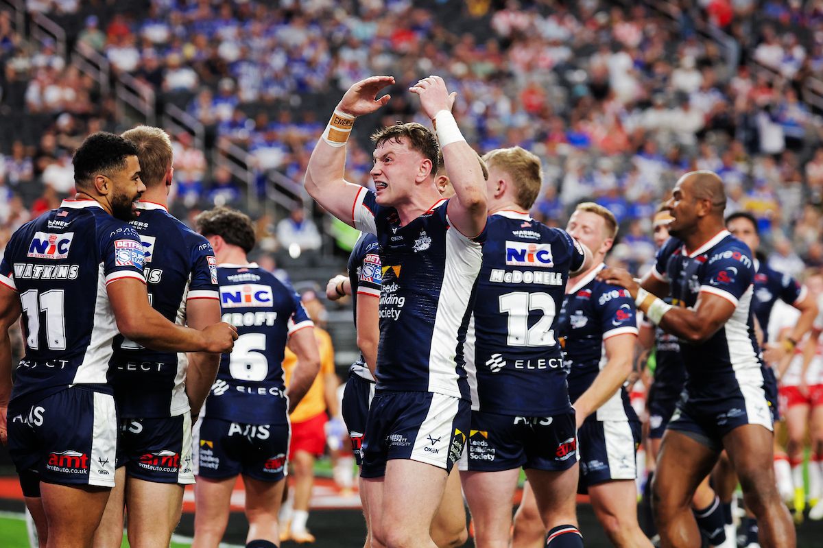 Harry Newman of Leeds celebrates after Brodie Croft of Leeds Try