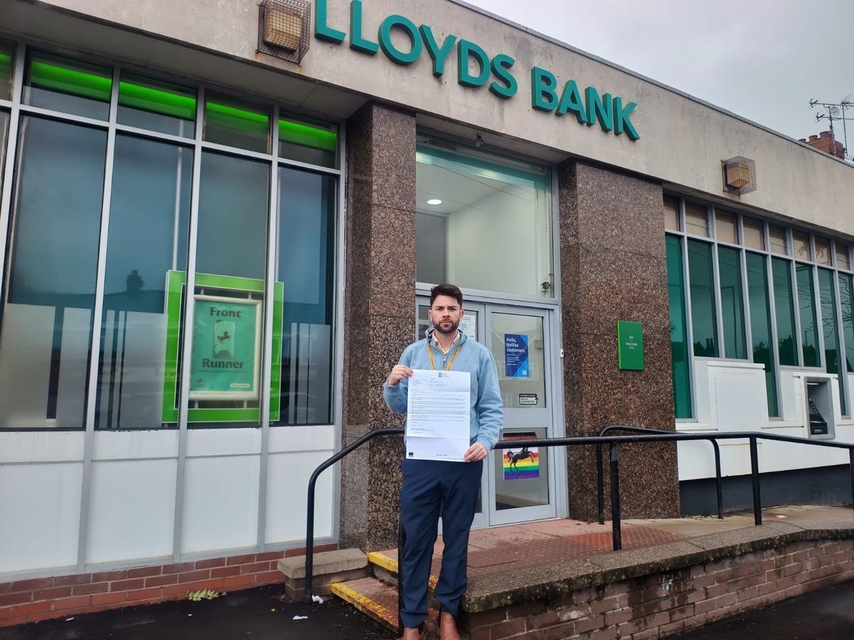 Cllr Jonathan Cahill with his letter outside the Ings Road branch 