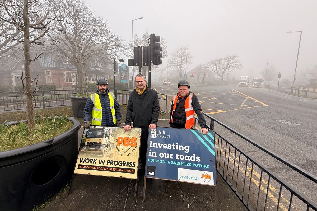 Councillor Mark Ieronimo, portfolio holder for transport and infrastructure at Hull City Council, pictured centre with representatives from PBS Construction at the National Avenue/County Road North junction