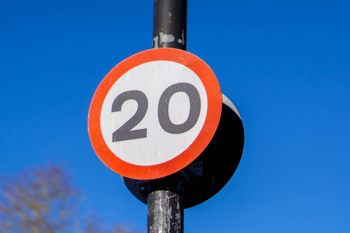 Saffron Walden, Essex, UK - January 15, 2024: 20mph speed limit sign against a blue sky