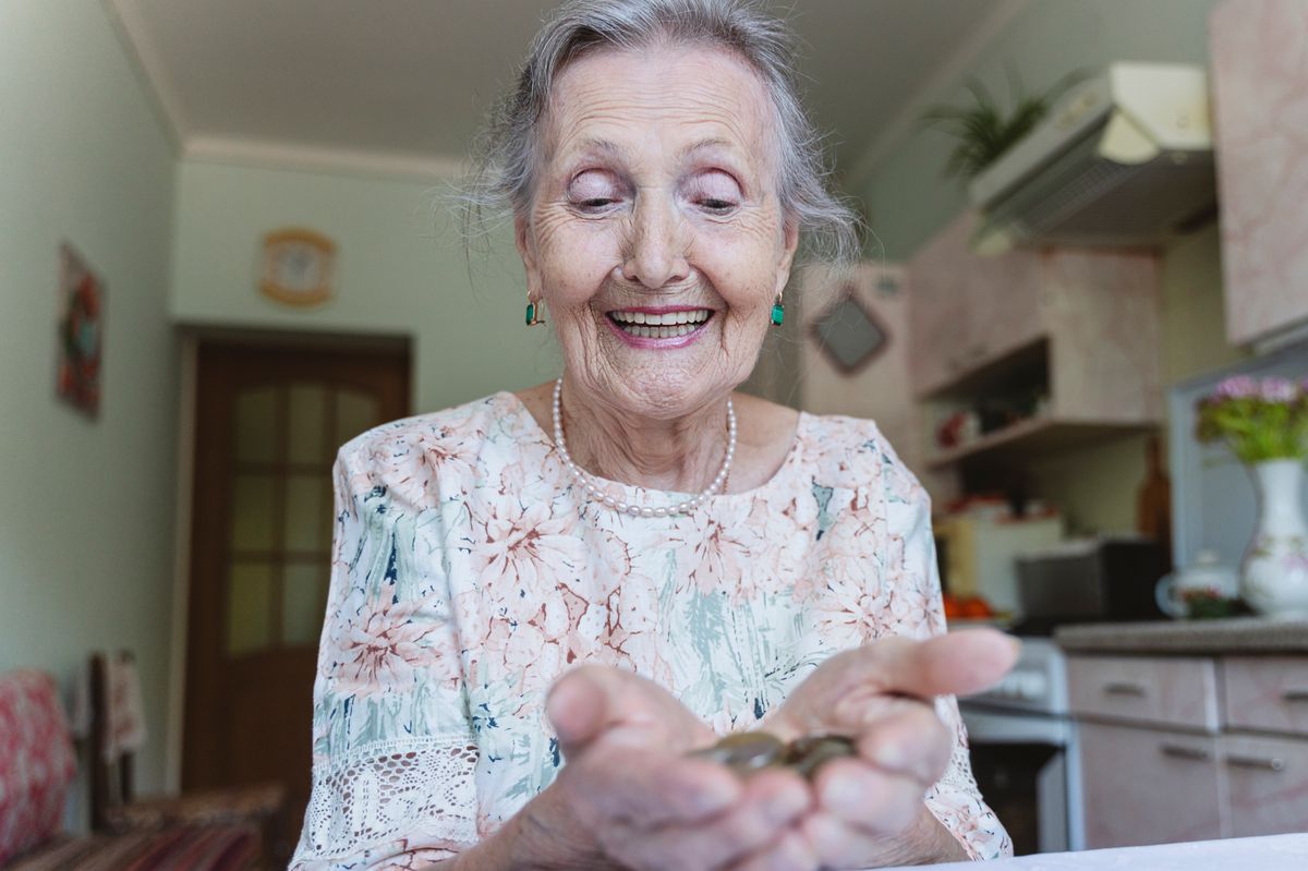 Woman looking at coins